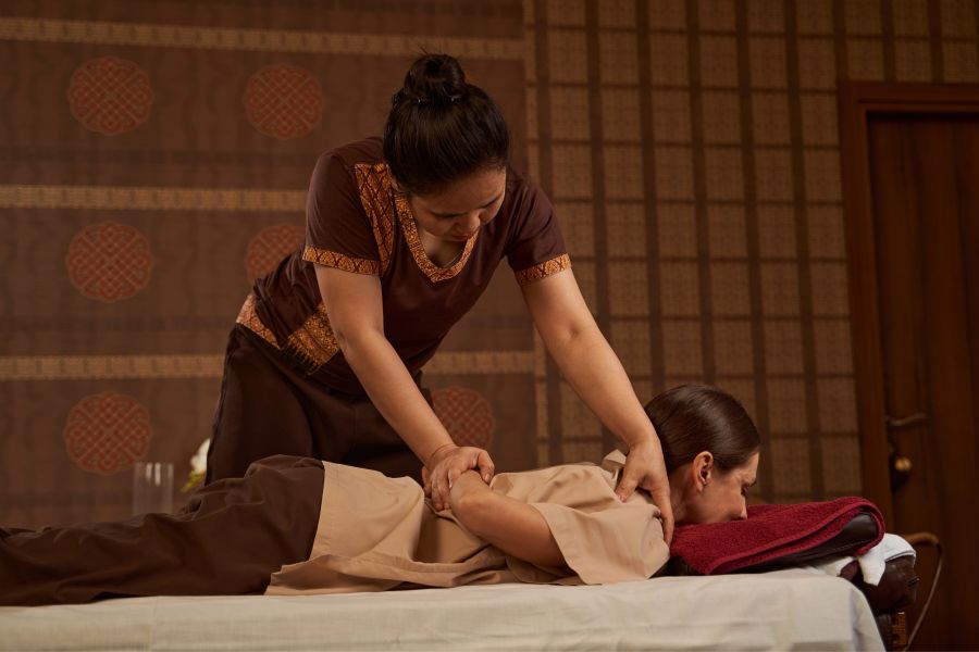 woman giving a Thai massage